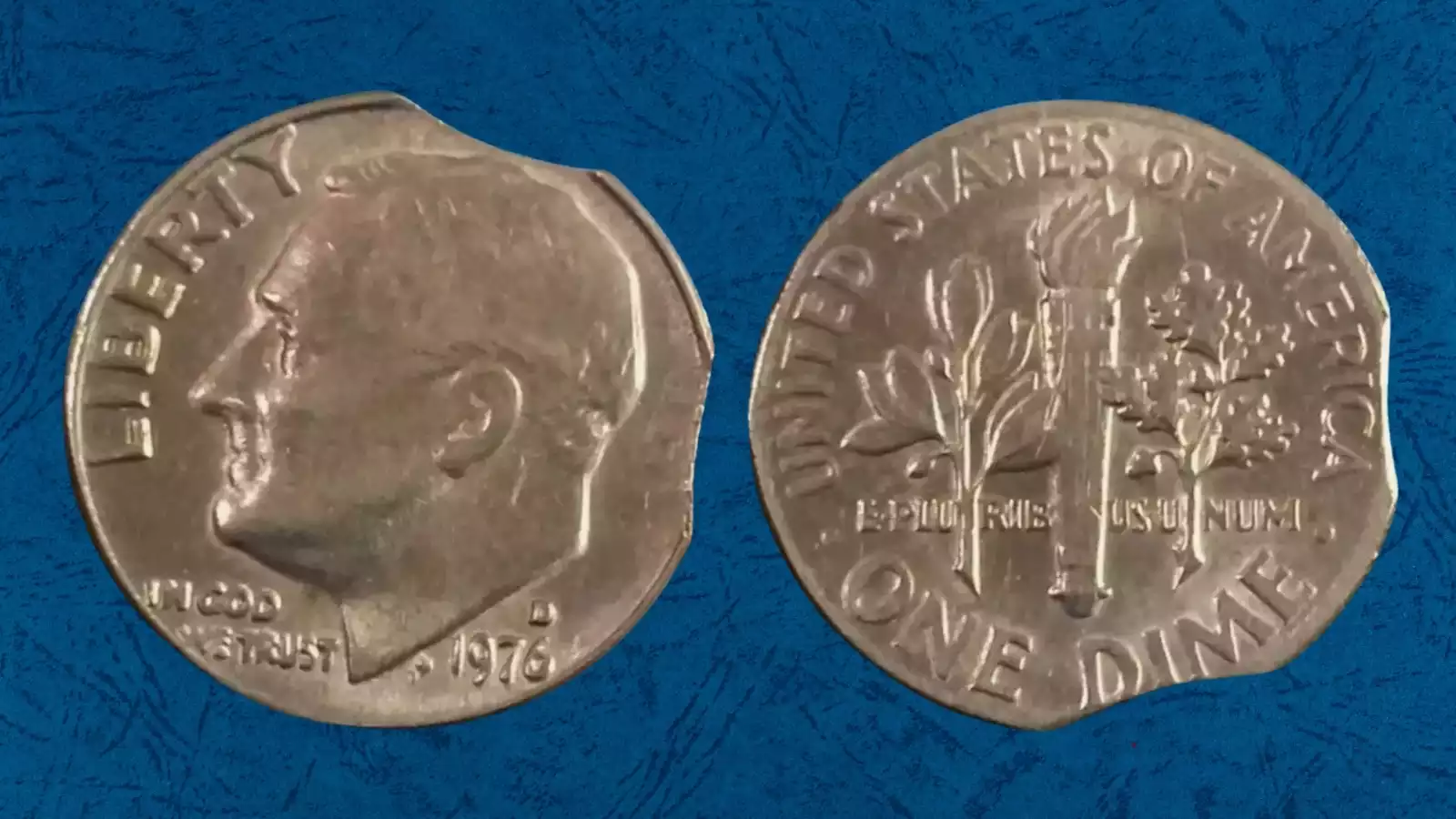1976 dime curved clipped planchet error showing missing rounded section at coin edge